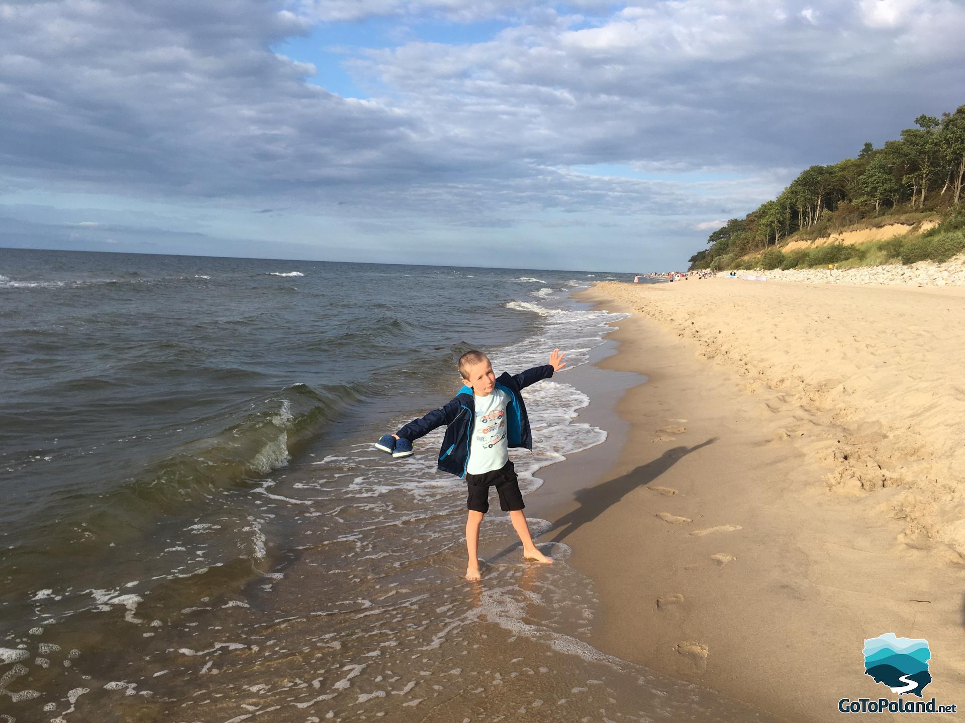 a boy is on the beach