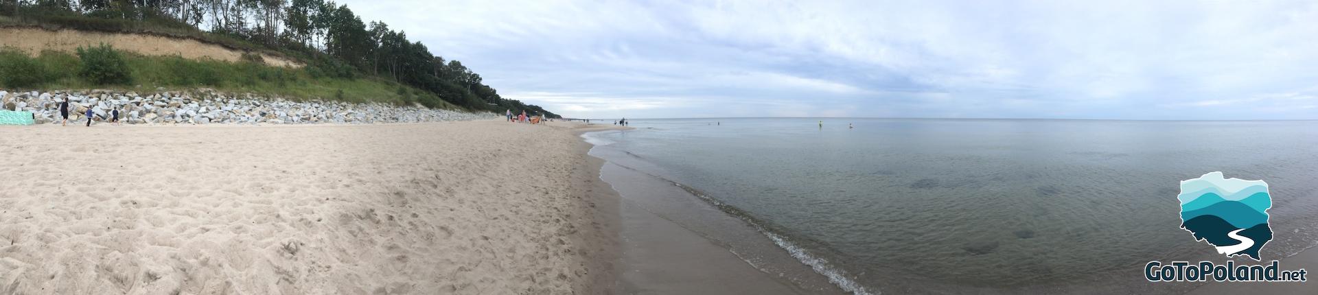 a panoramic photo of sea and the beach