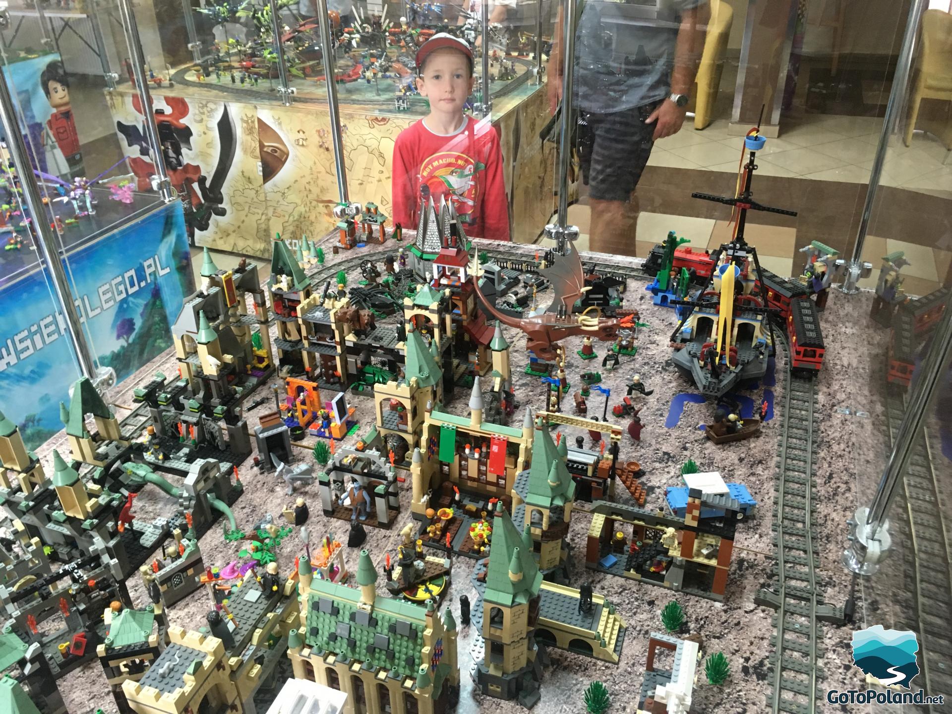 a boy at an exhibition of lego 