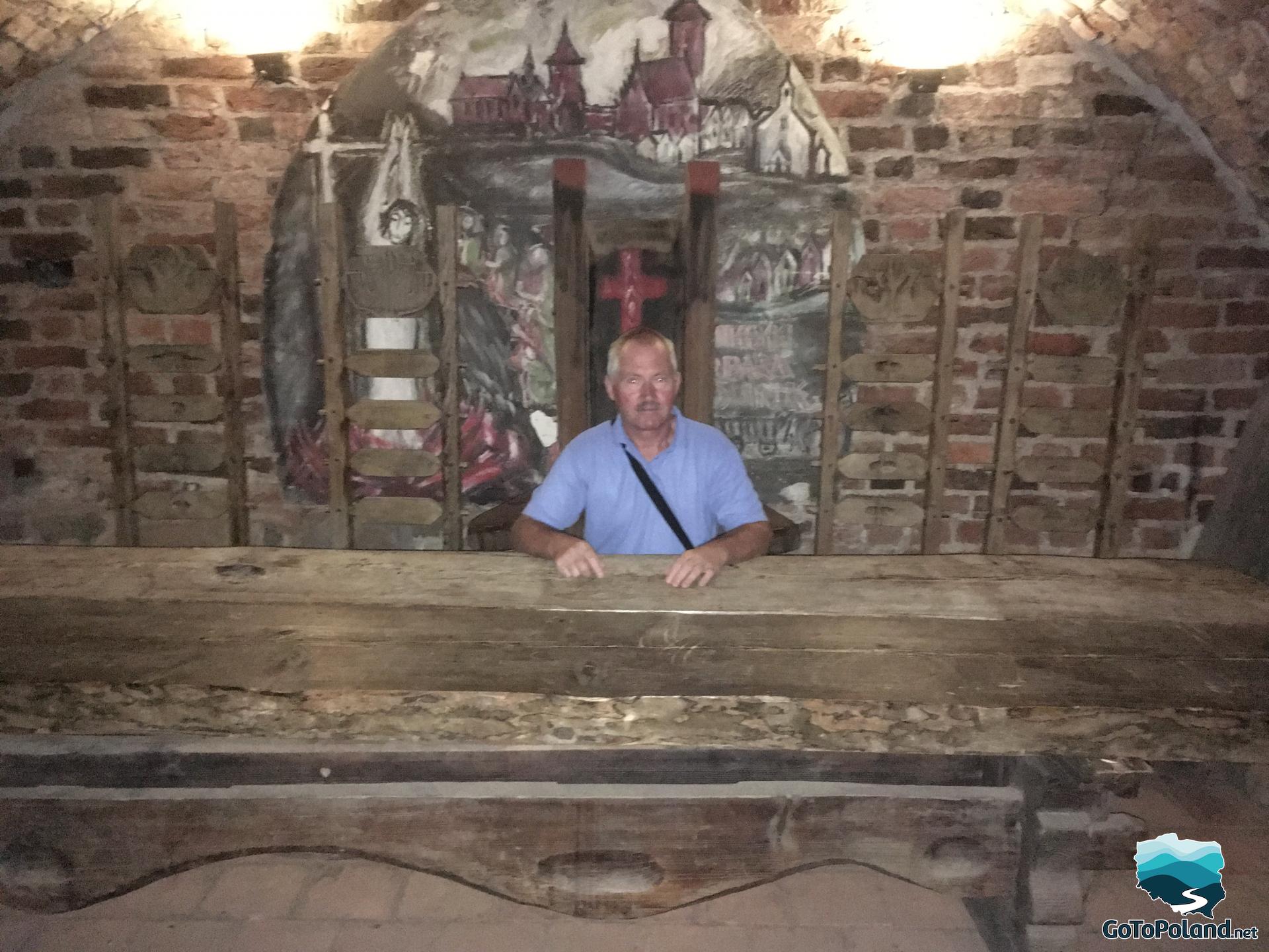 a man is sitting in hall of the castle