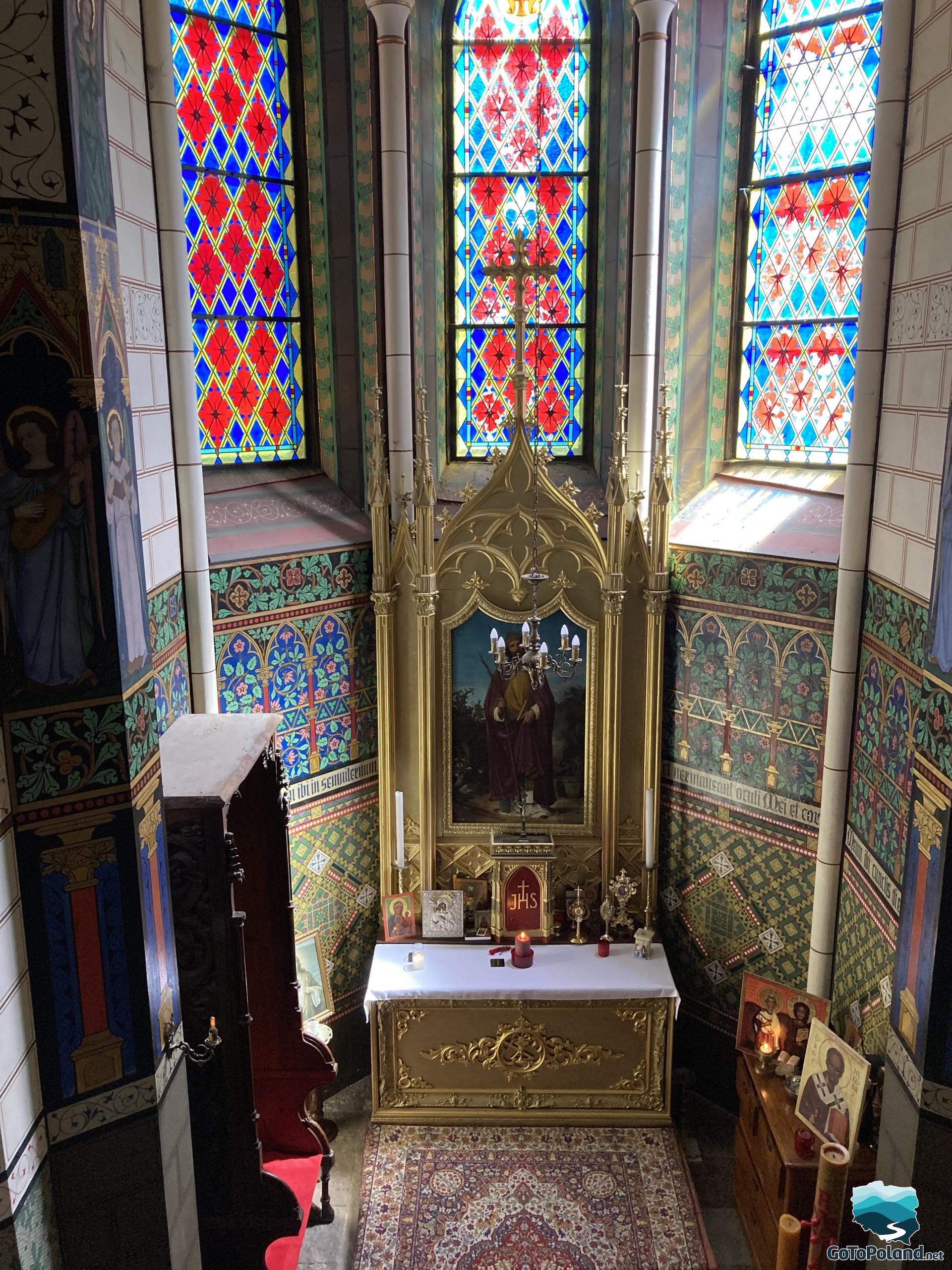 chapel with stained glass windows and altar