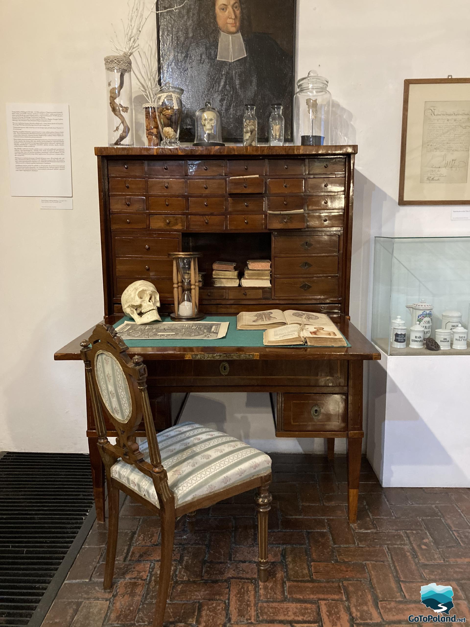 a wooden desk with many drawers where a doctor used to work