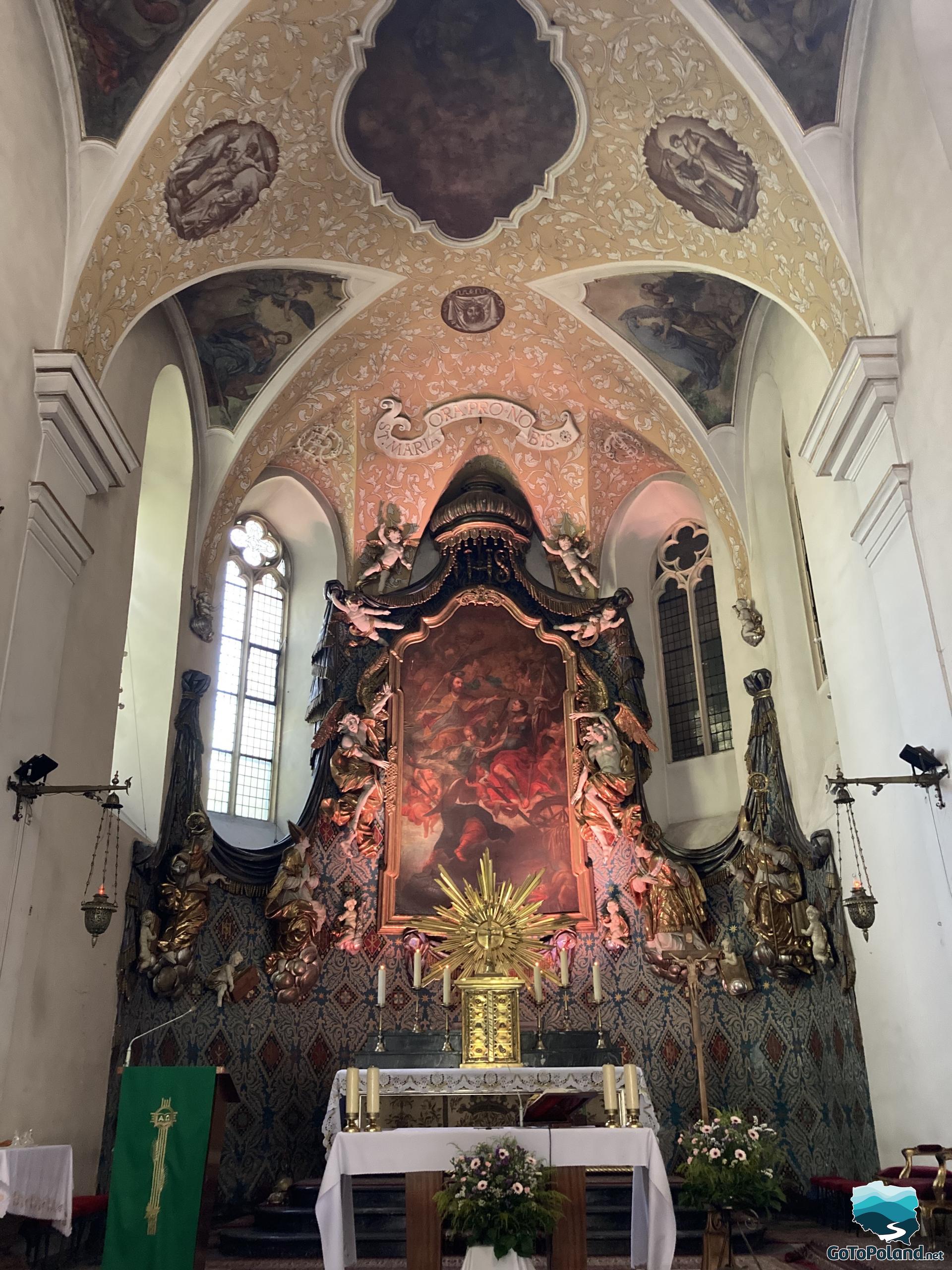 the main altar in the church lit in red