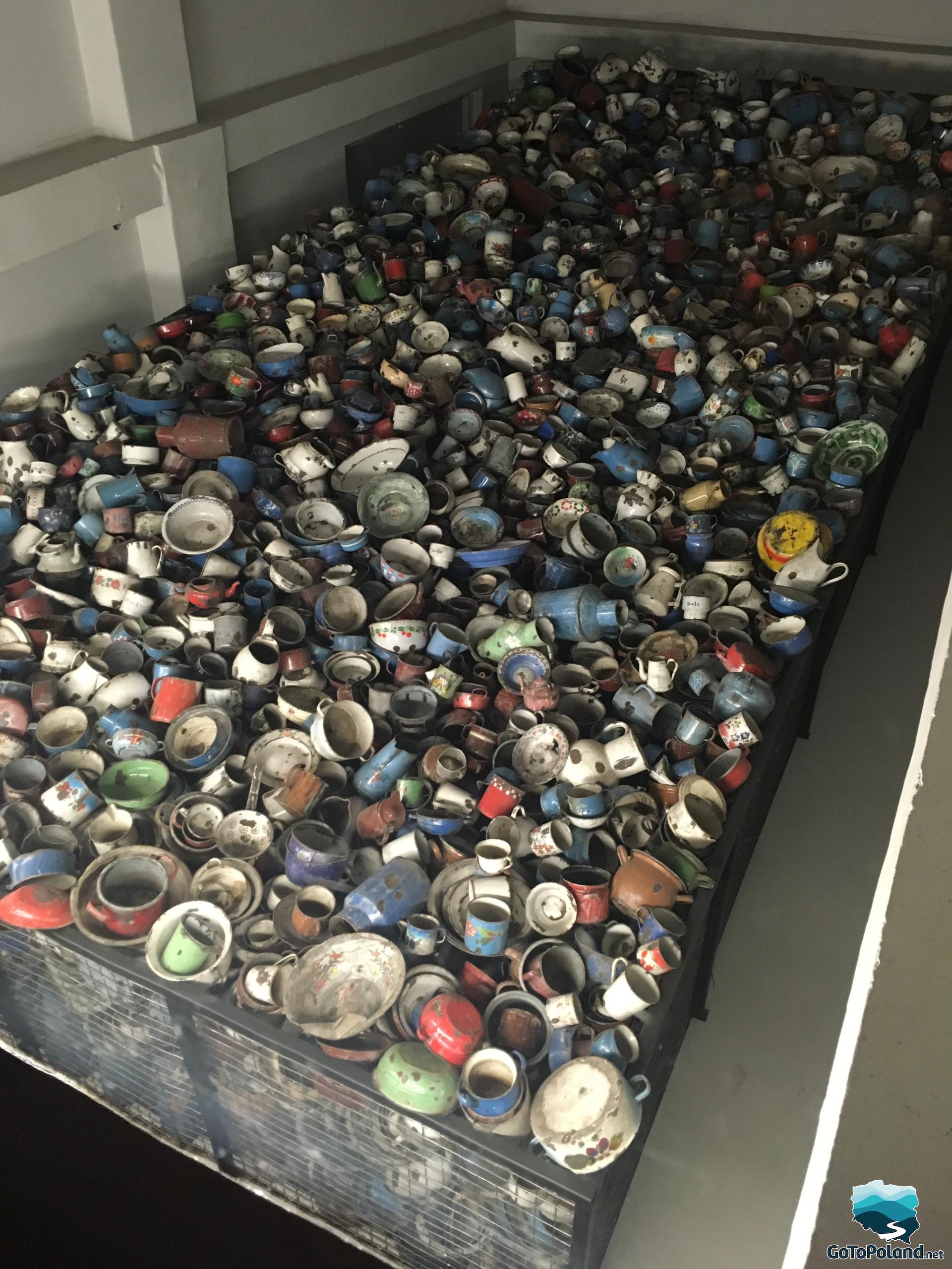 hundreds of old mugs left by prisoners