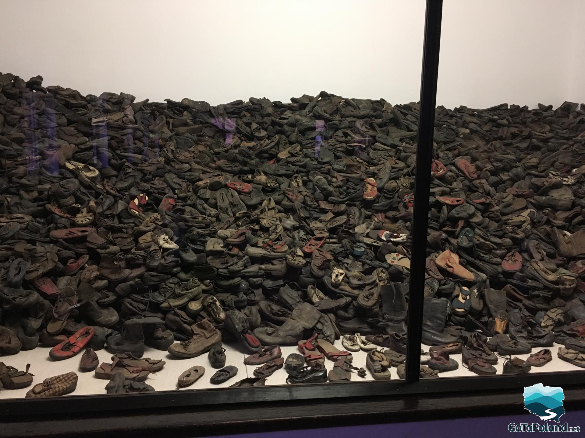 hundreds of old shoes left by prisoners