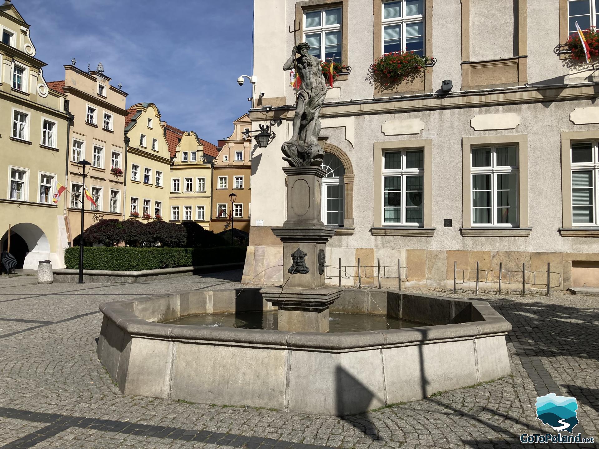 a stone fountain presenting Neptun