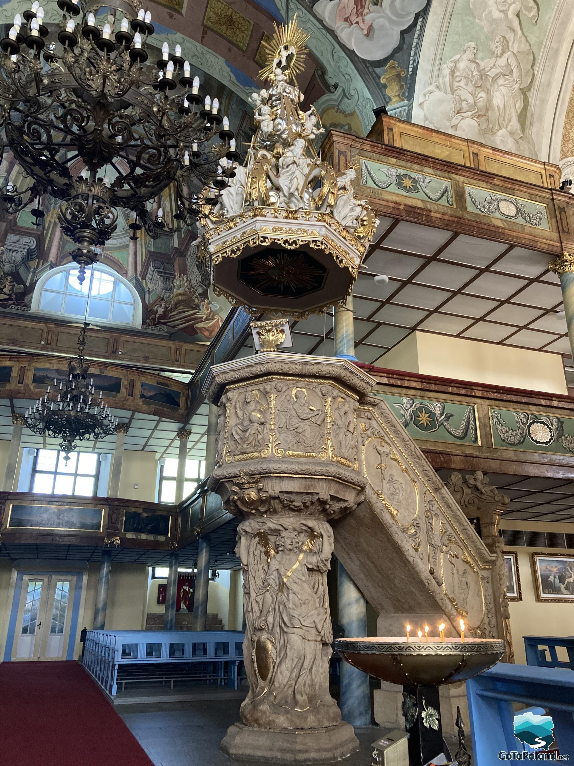 richly decorated pulpit with figures of saints