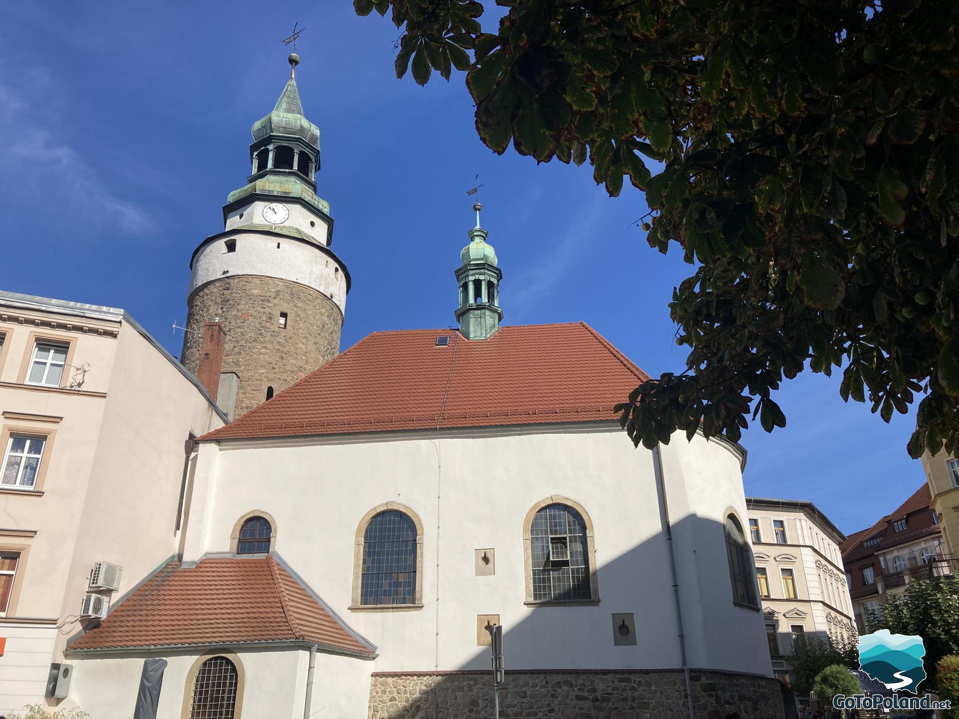 the chapel building and a round tower behind it