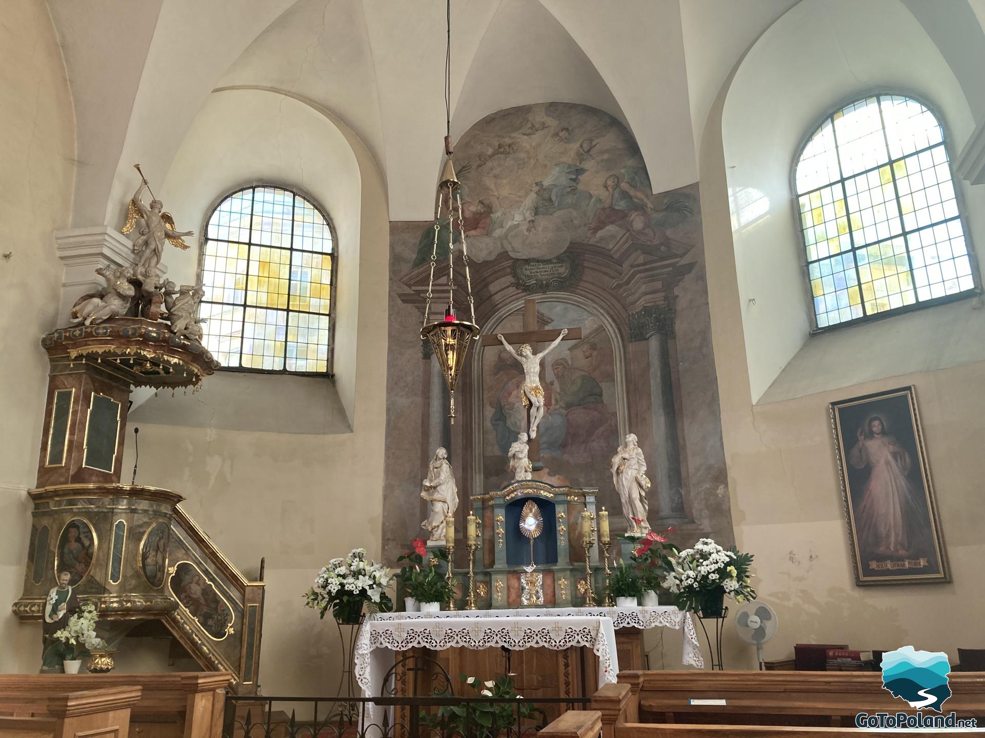 On the left is the pulpit, the altar in the center of the chapel