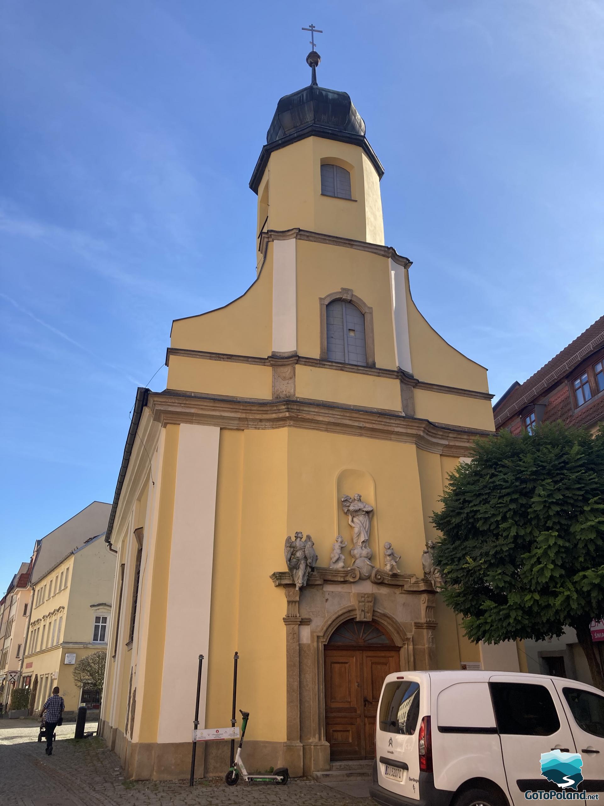 a church with yellow facade 