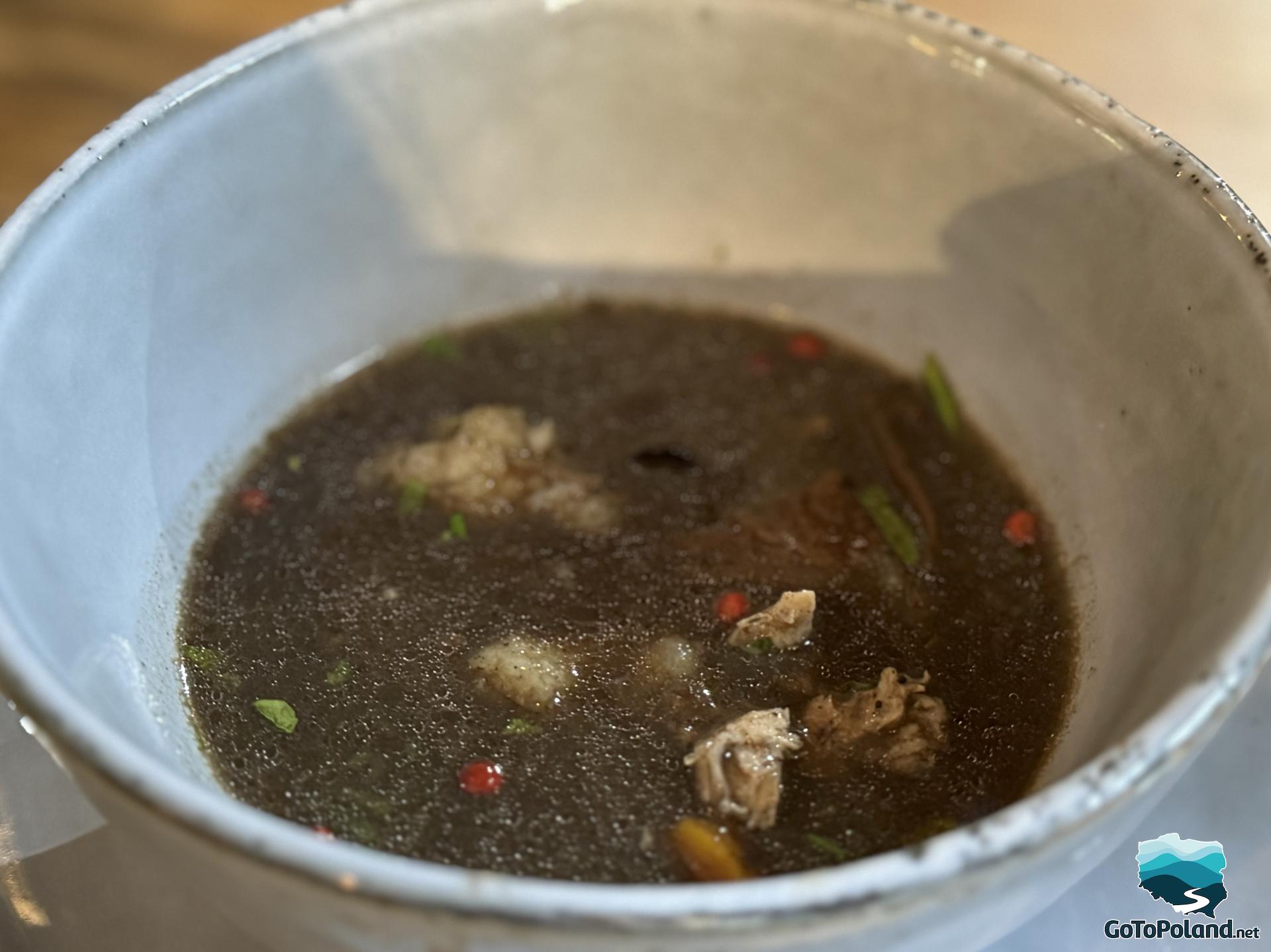 black soup in a white bowl