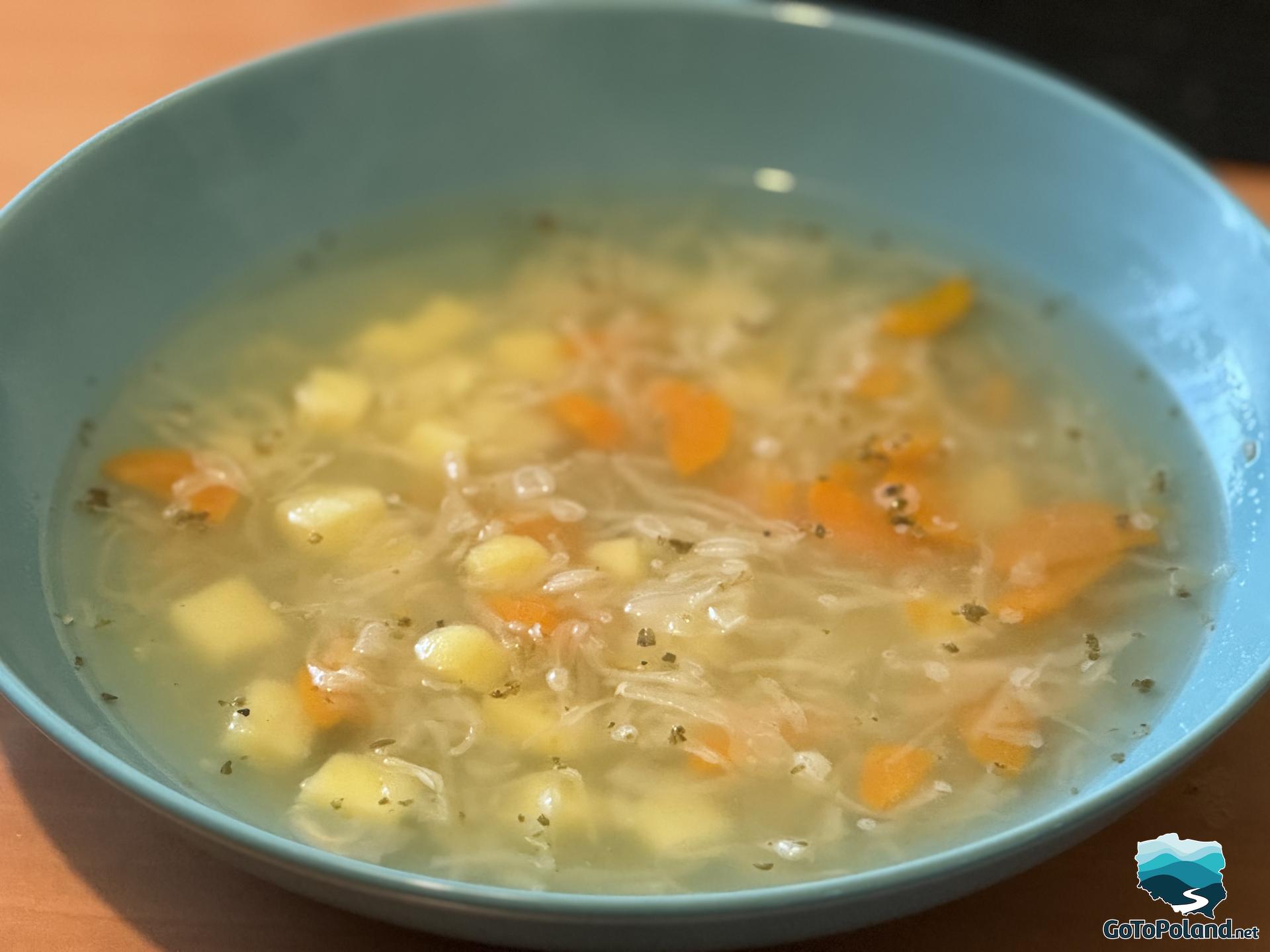 a soup in a blue plate