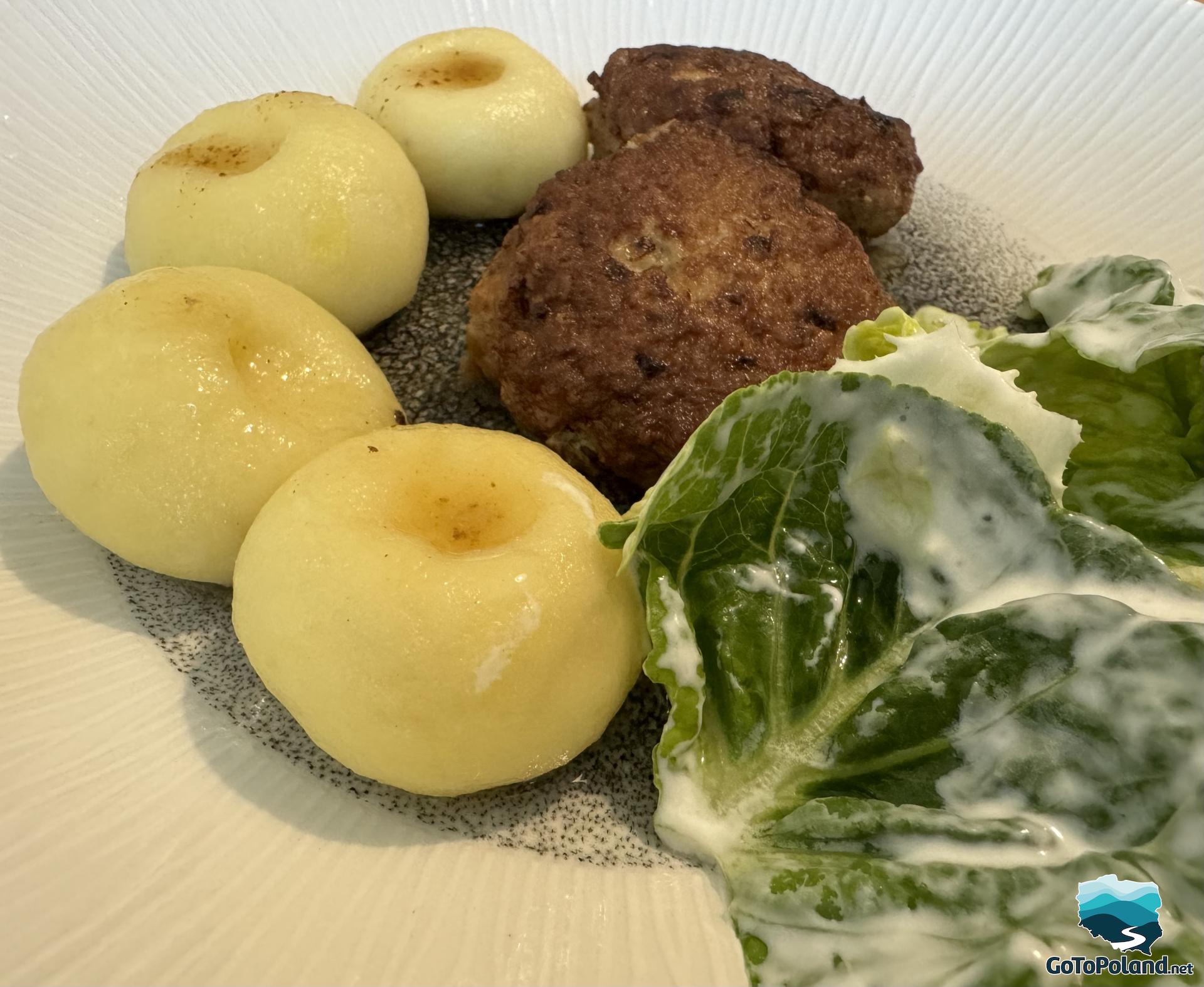 lettuce, chops and dumplings on the plate