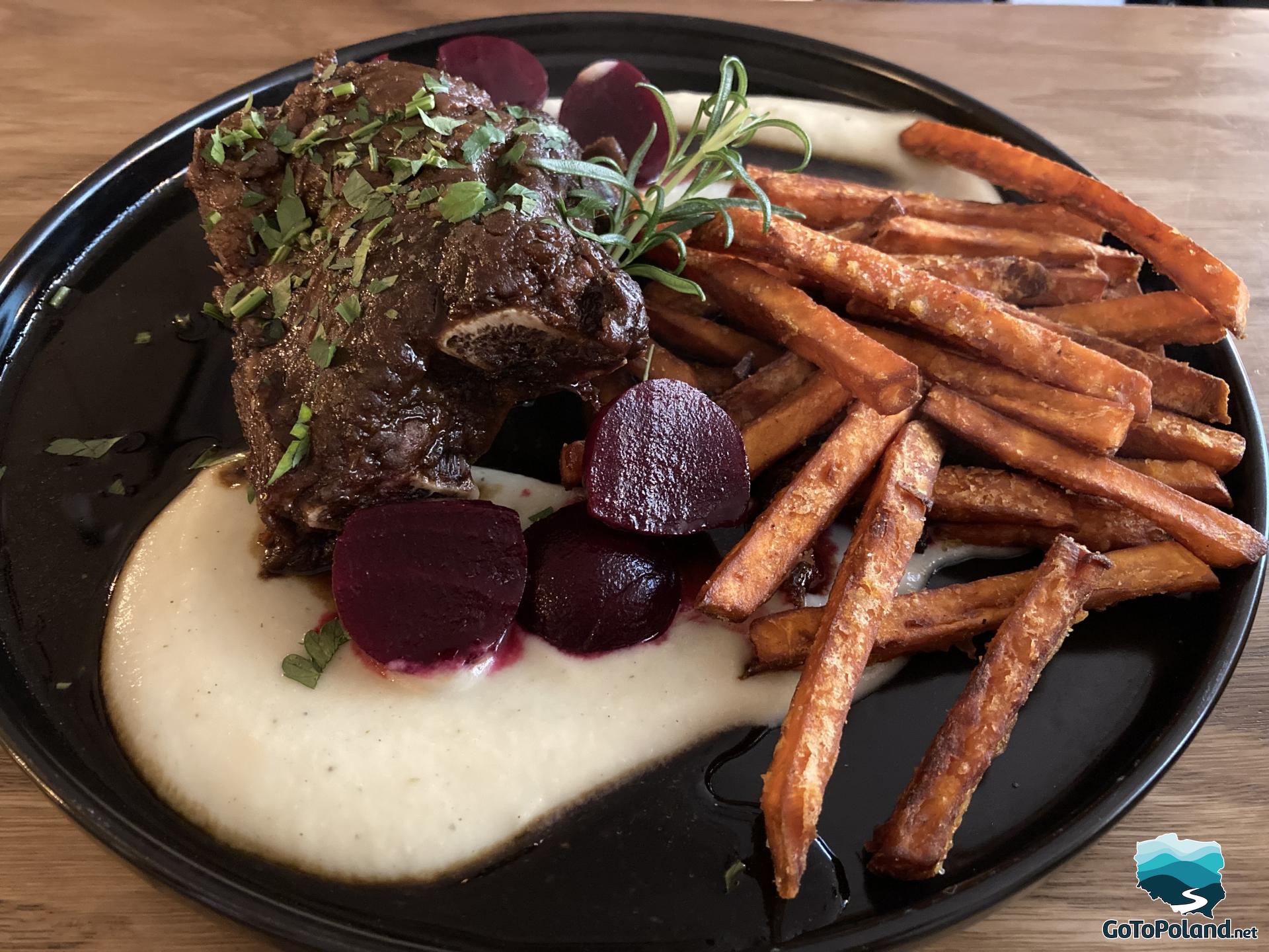 meat in sauce with beetroot and baked sweet potatoes