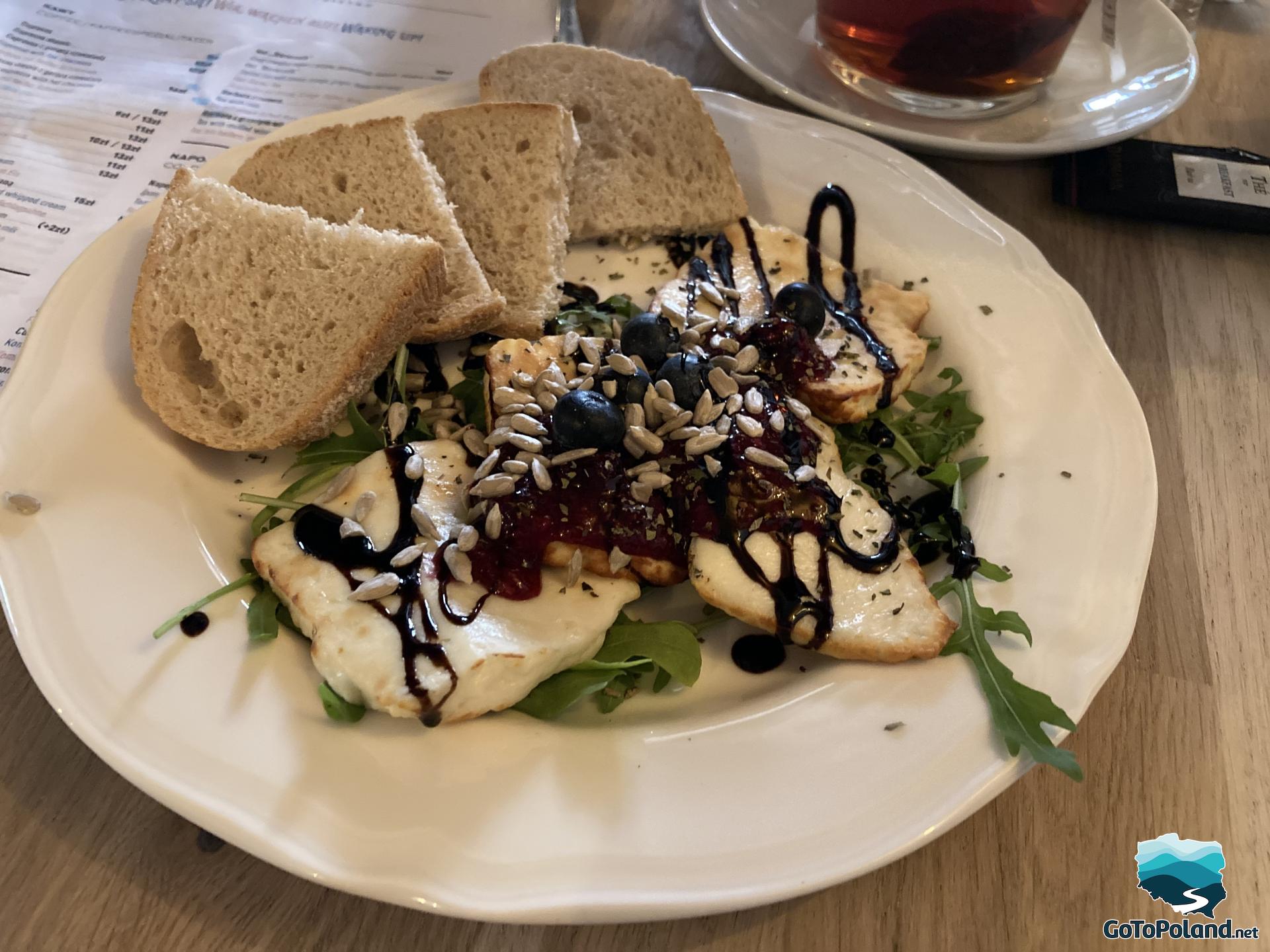 plate with bread, cheese and lettuce