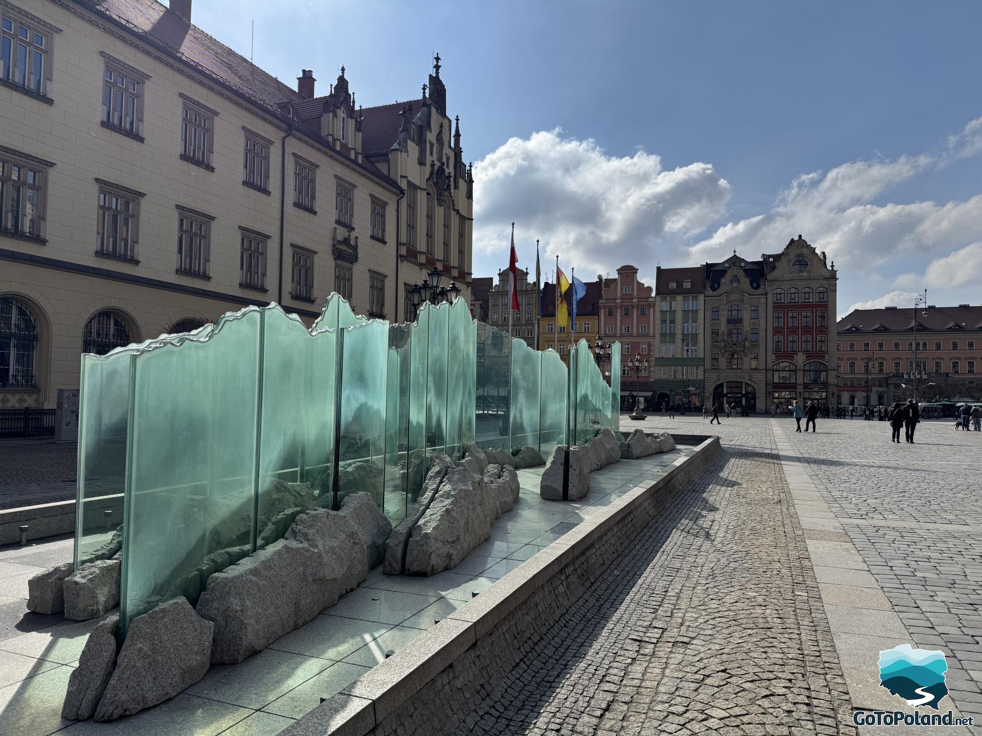 a fountain made of glass imitating a surface of water
