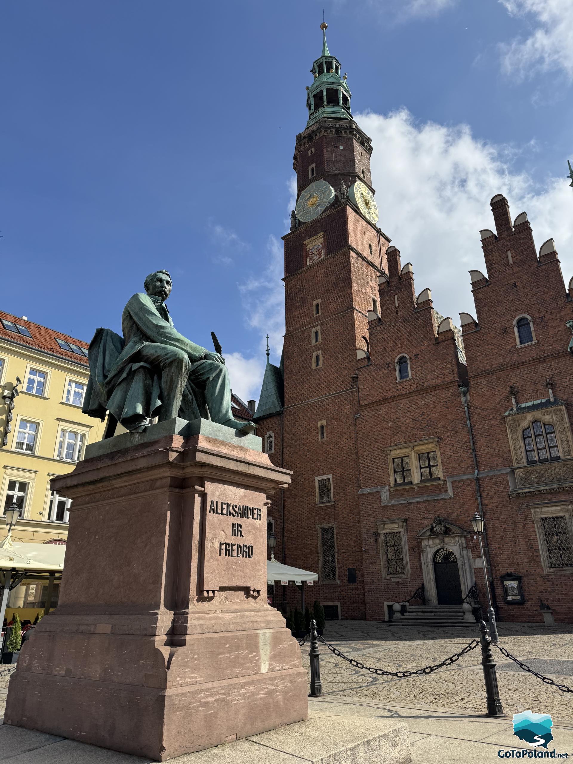 monument to a Polish writer in front of the town hall