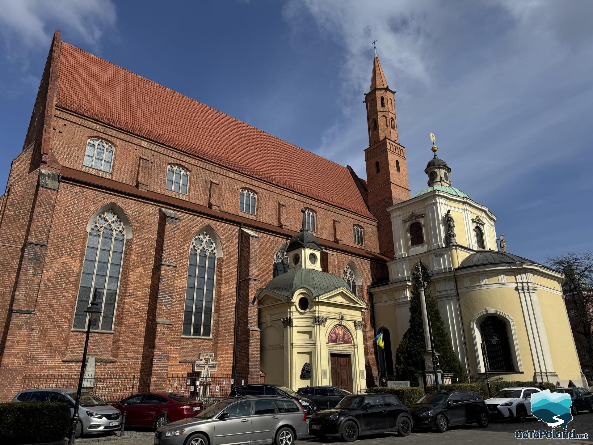 a brick church with an added baroque chapel