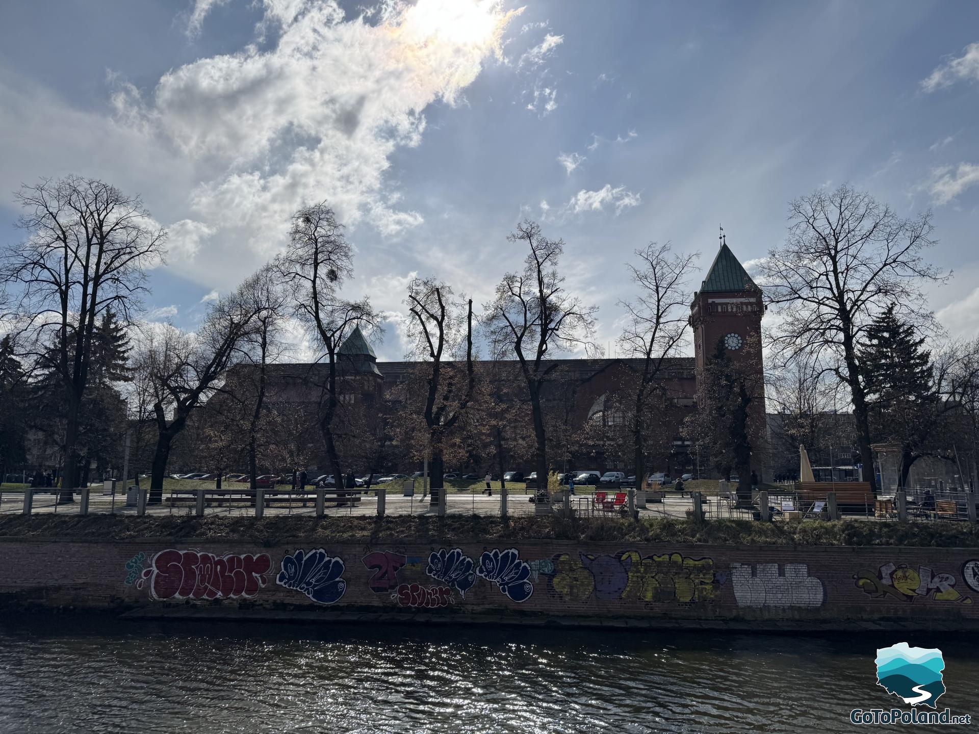 the market hall building seen from across the river