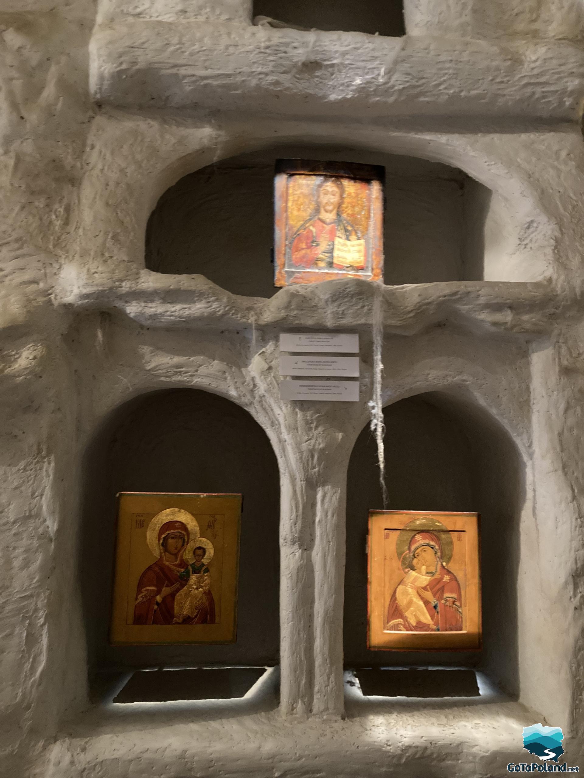 three icons close up in a room stylized as a hermits cave