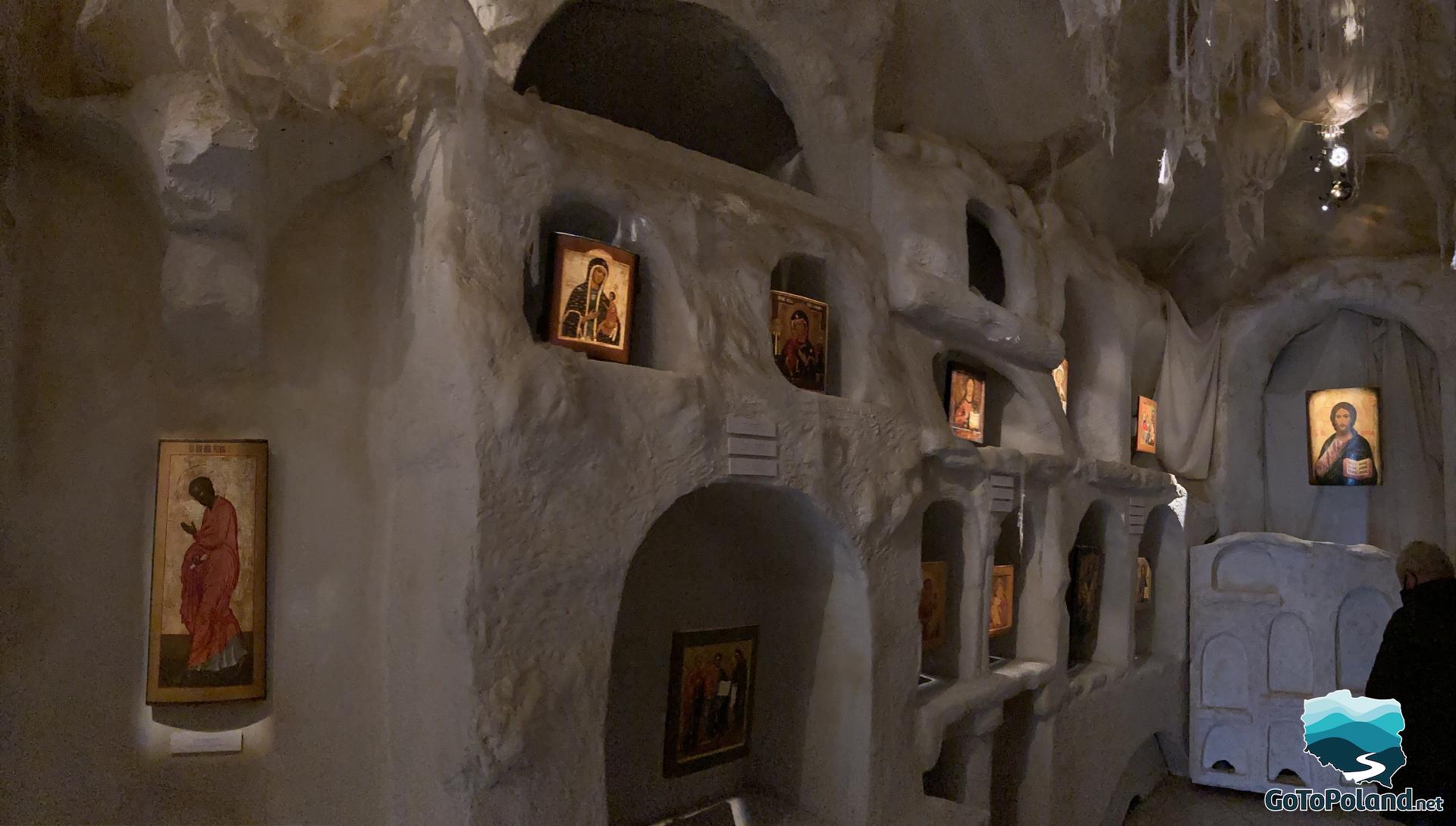 different icons in a room stylized as a hermits cave
