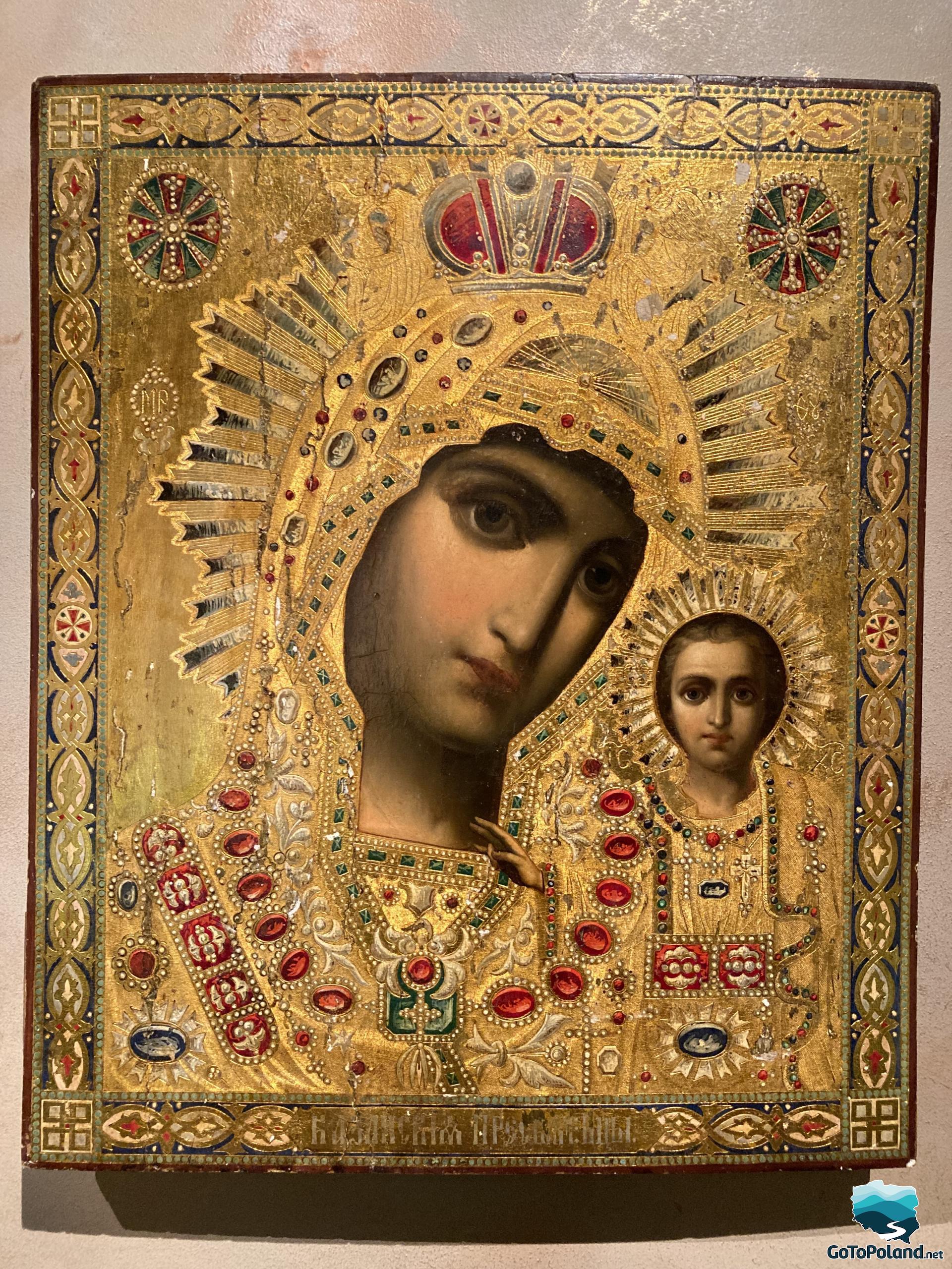 icon of mary with the baby covered with gold paint