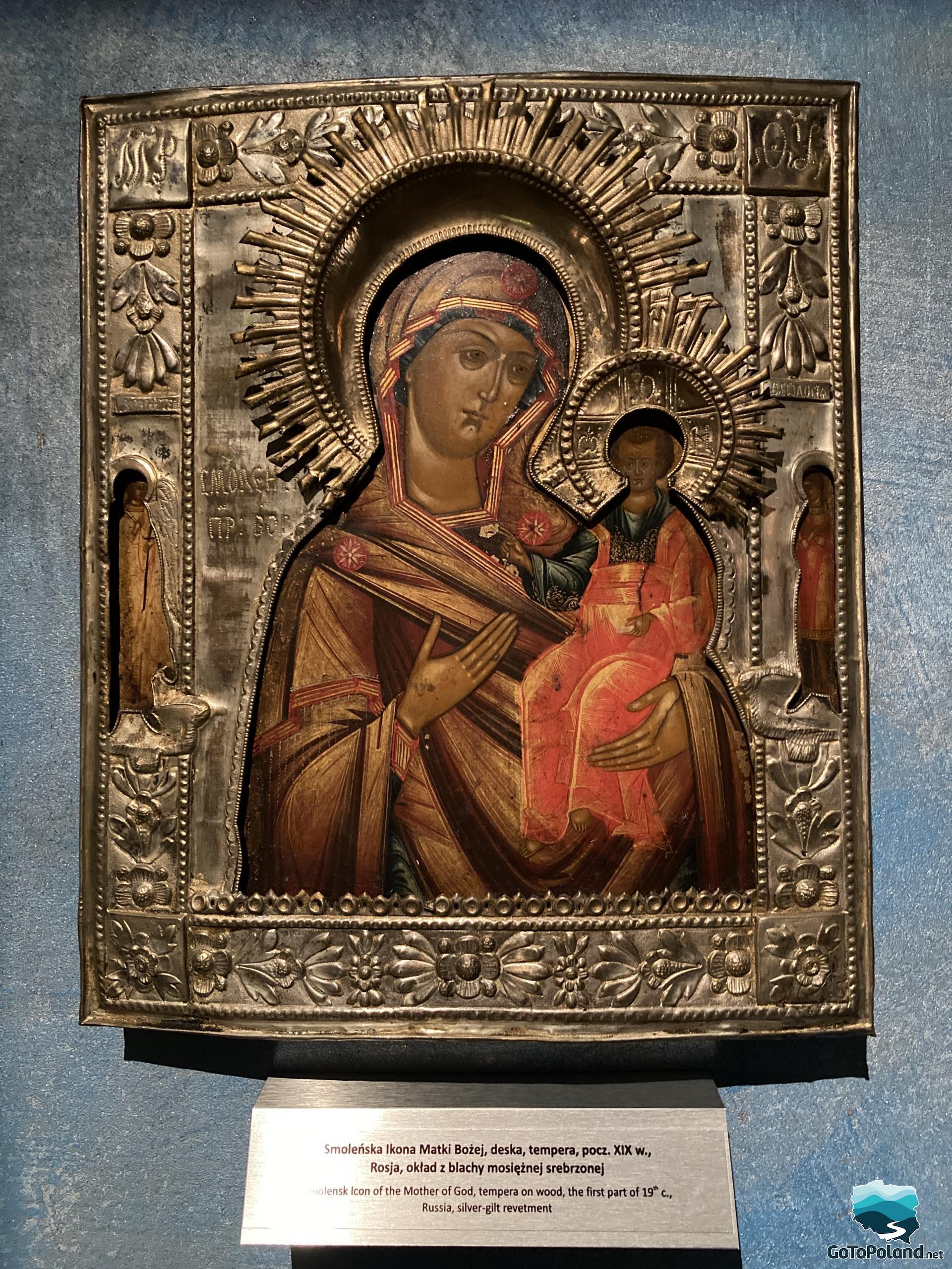 icon of mary with the baby in a silver frame