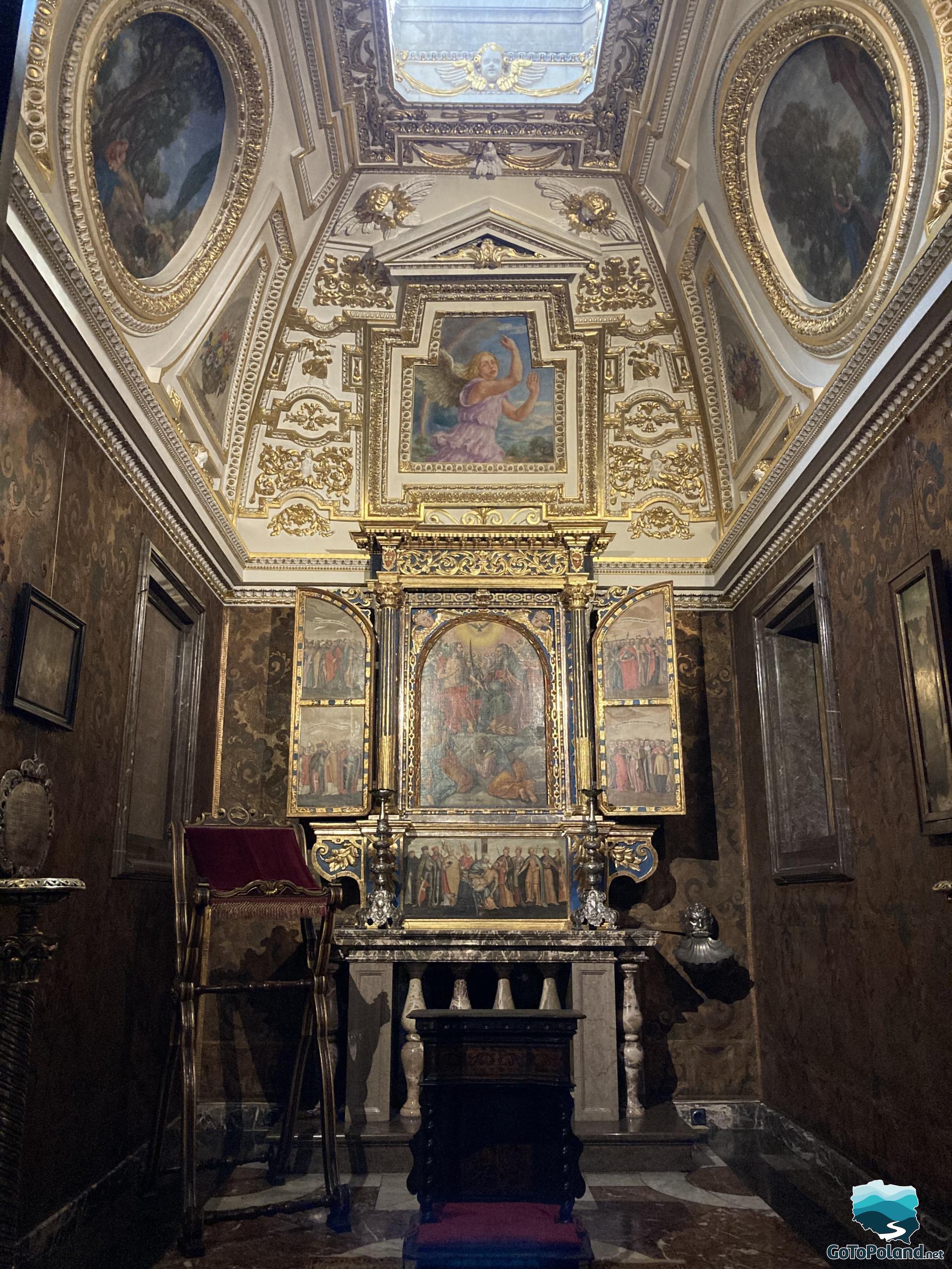 a chapel in the castle, with gold decorations and small altar