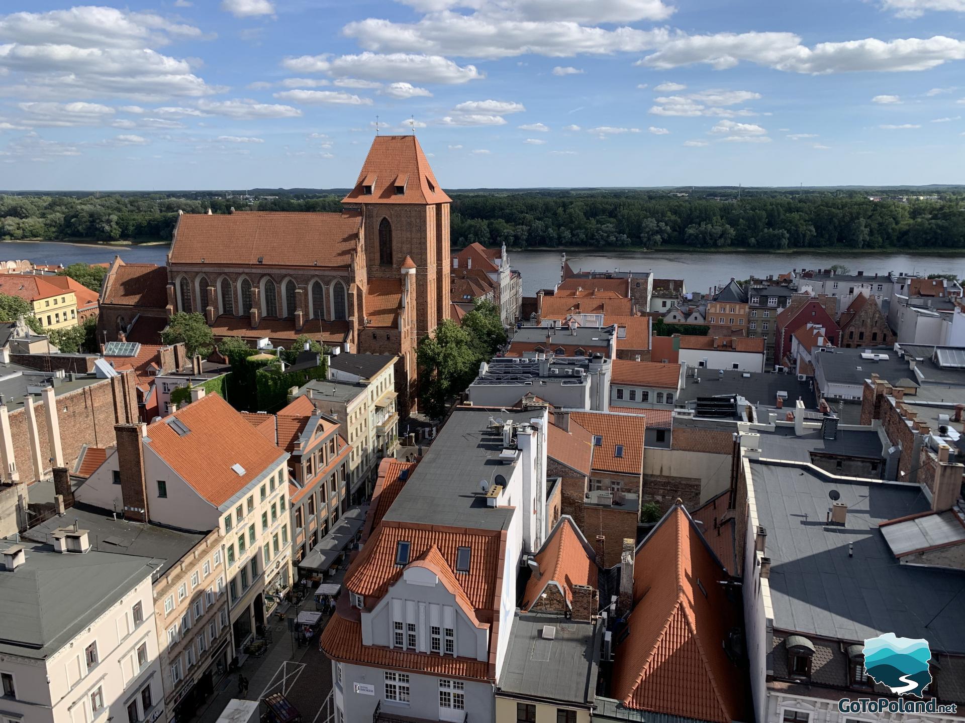 different city skyline view, a church and Vistula river in the background