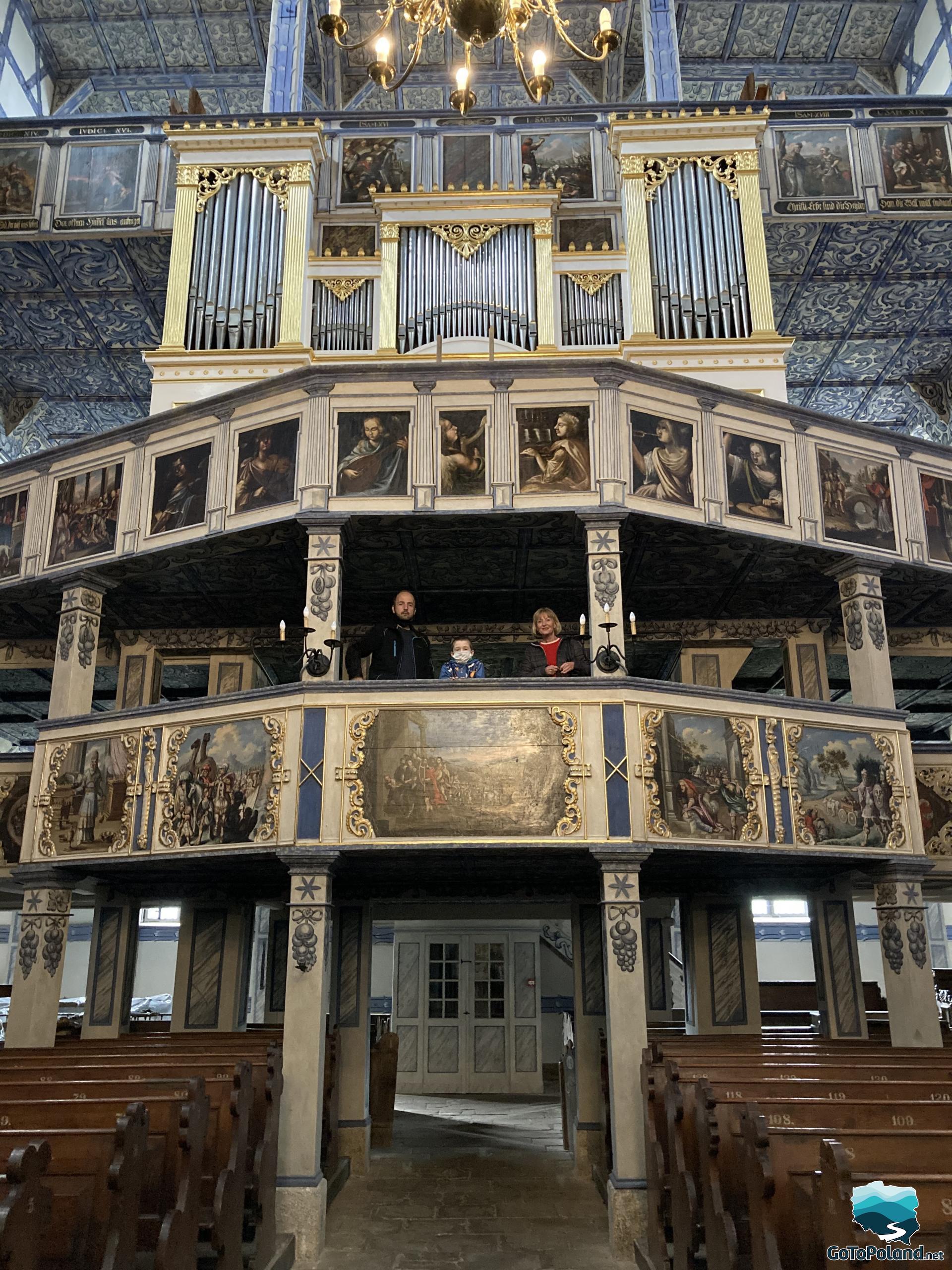 large organ in a church, whole church made of wood