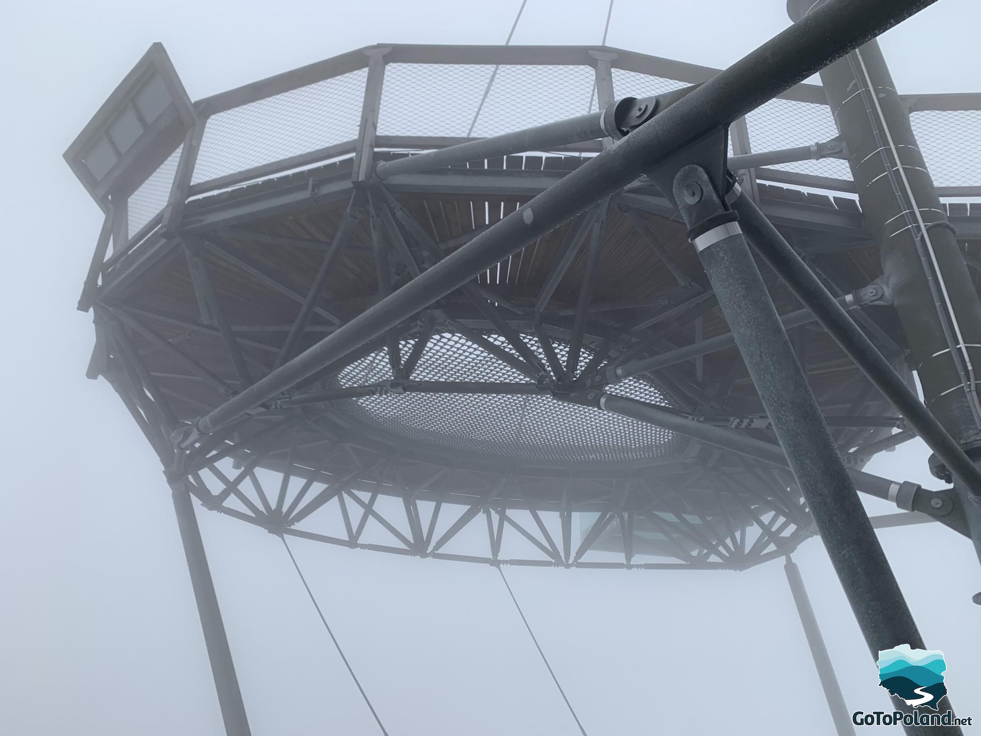 n the fog at a very high altitude hangs an attraction for tourists in the form of a drop-shaped net