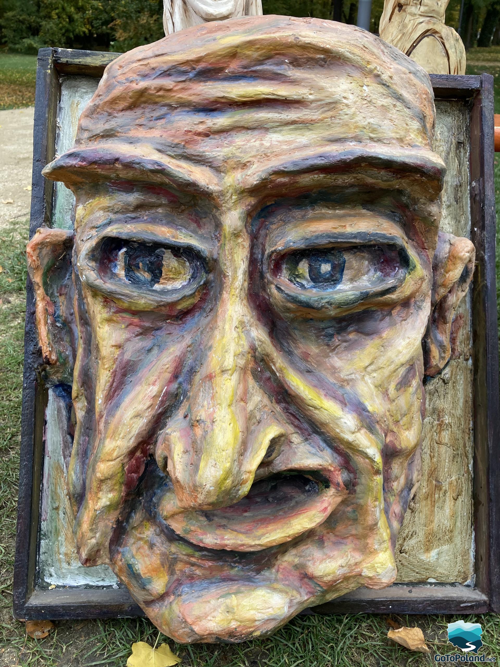 a mask made of wooden close-up