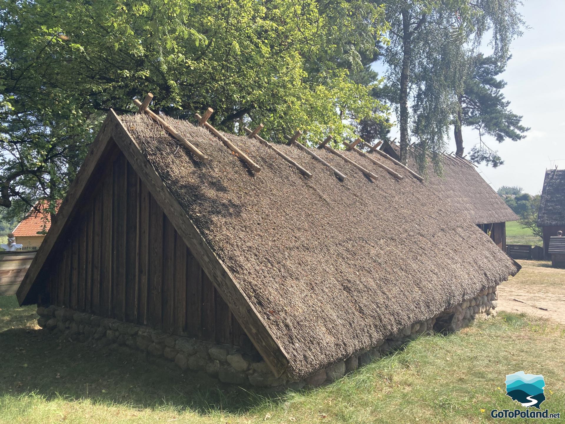 a peasant hut with thatched roof