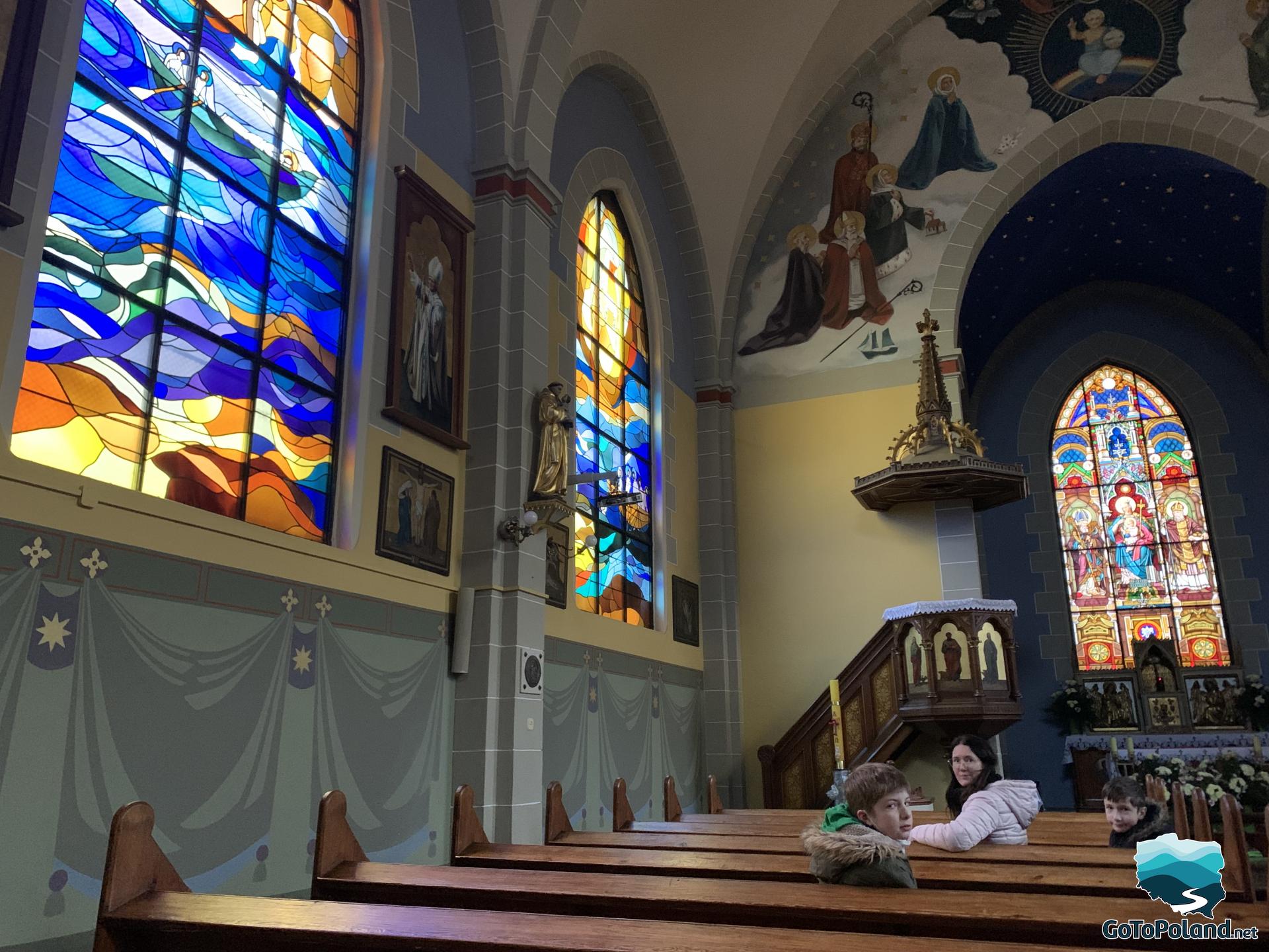 church interior with colorful stained glass windows