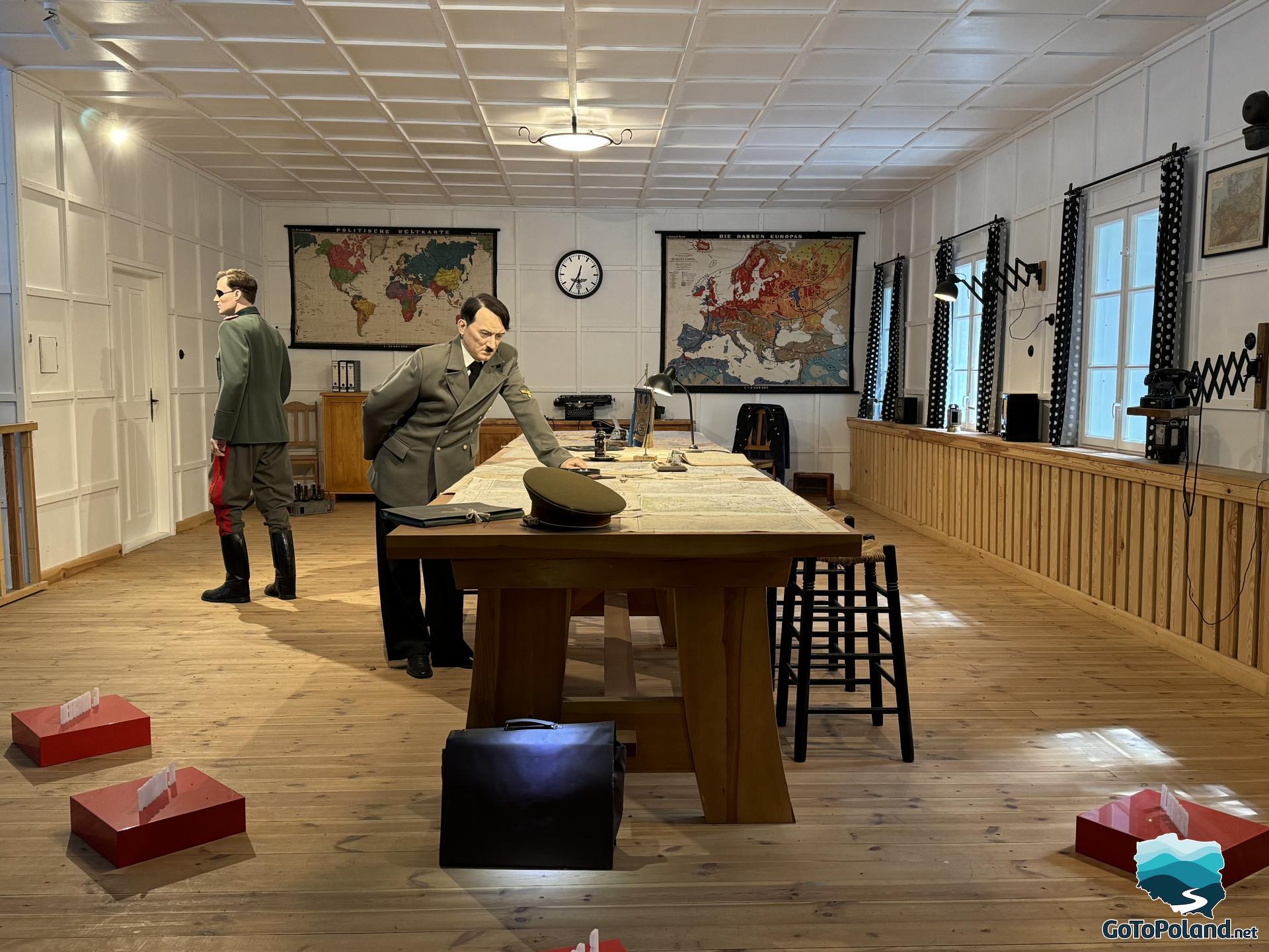 reconstruction of the room in which Hitler's figure leans over the table