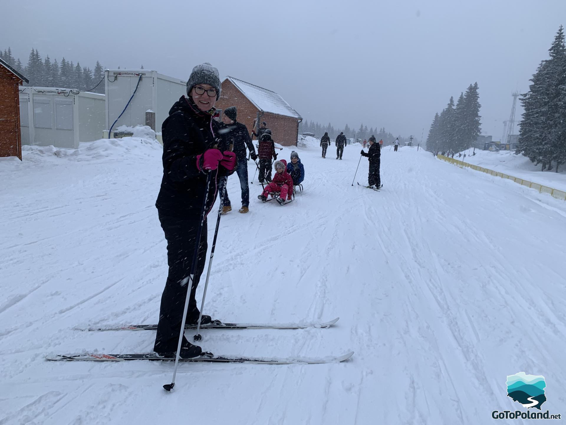 A woman on cross-country skies in a blizzard