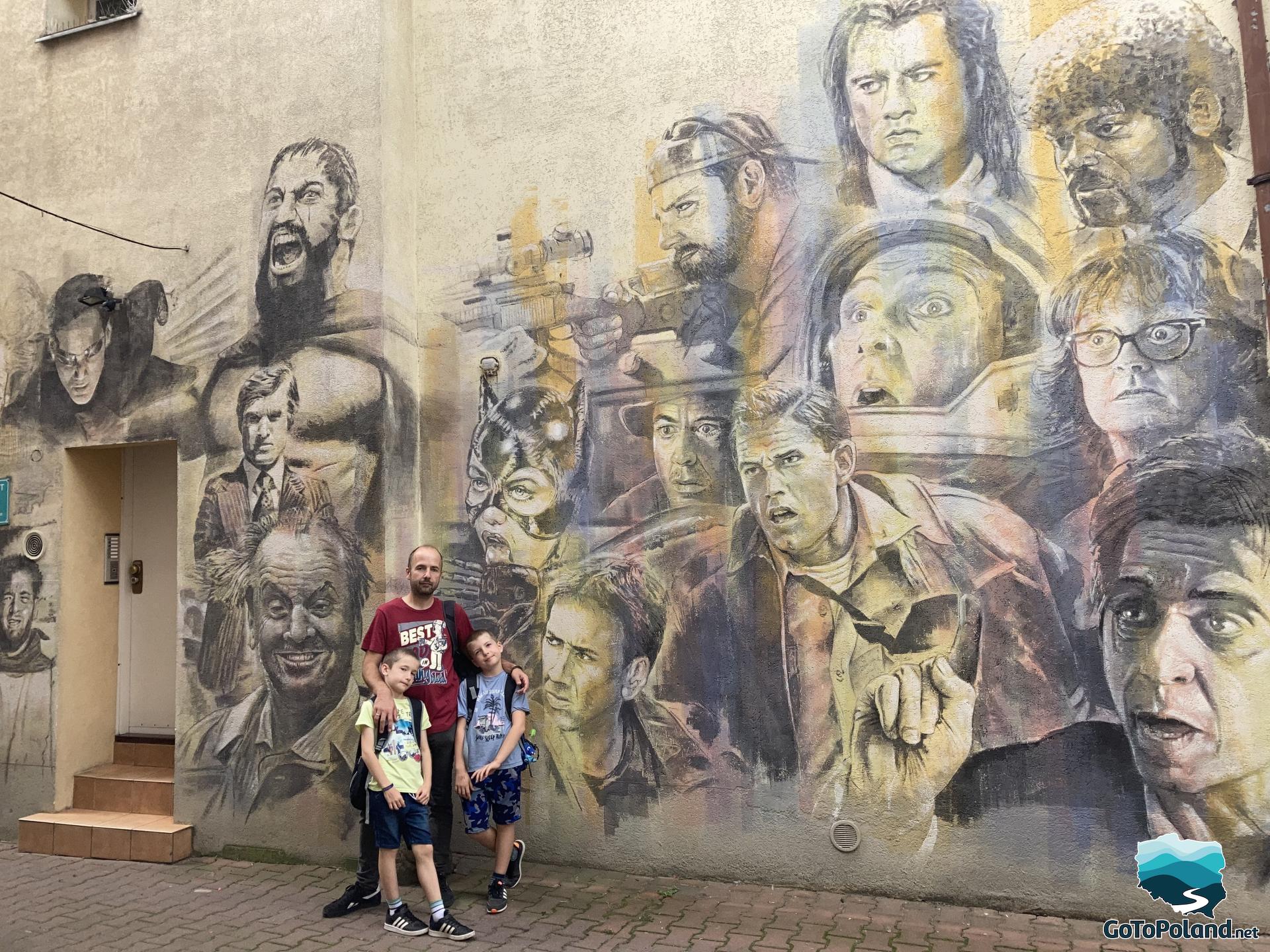 A huge mural with famous actors painted on the wall